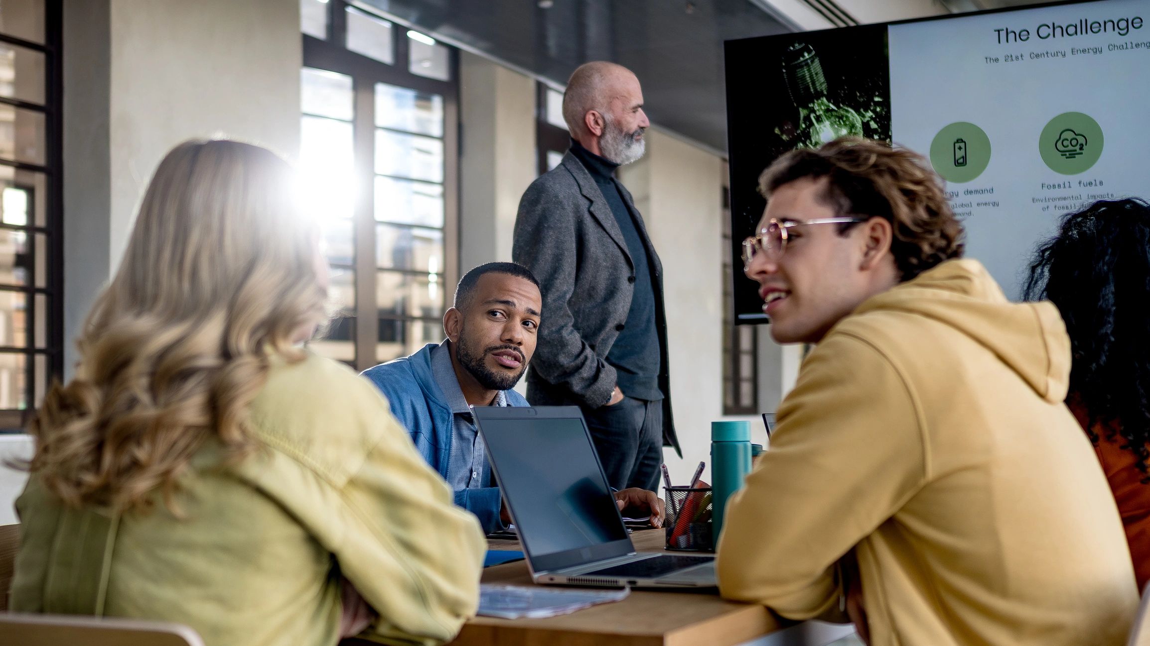Engineering team collaborating in a modern meeting room